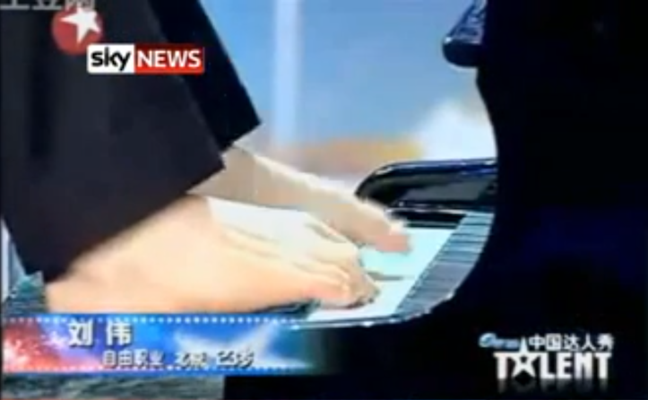 Playing the piano with his feet