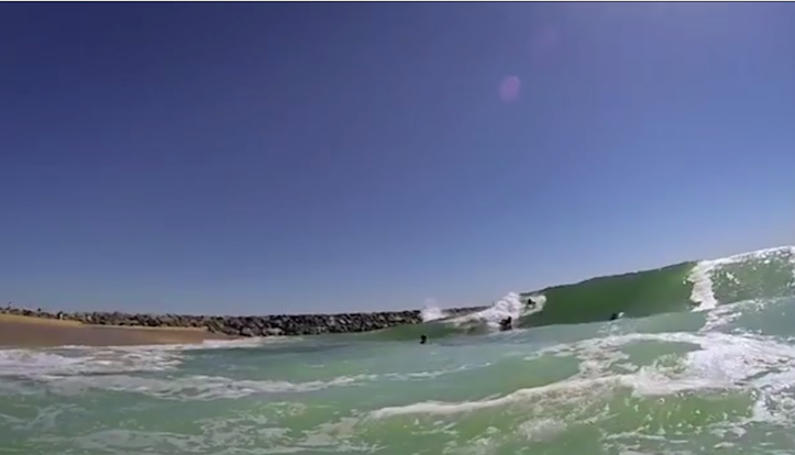 Body boarder eaten by wave