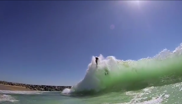 Body boarder eaten by wave