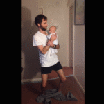 puttings-pants-on-holding-baby-1.png