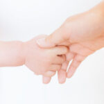 holding-a-babys-hand-pakutaso.jpg
