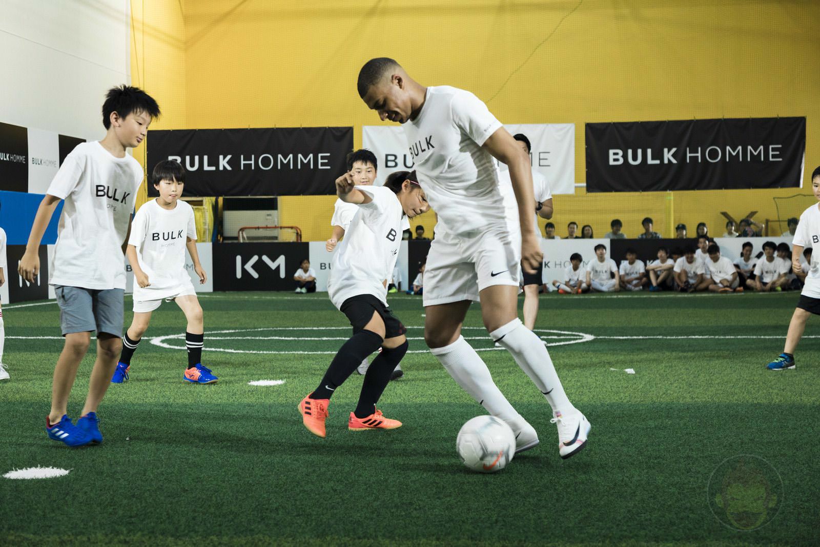 Kylian Mbappé plays soccer with kids 14